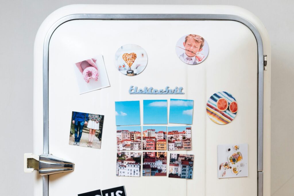 assorted-type photos stick on white single-door refrigerator