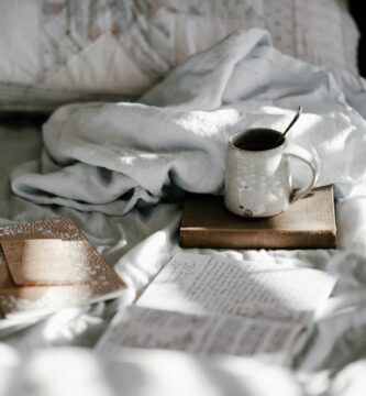 white and gray bed sheet