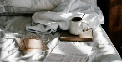 white and gray bed sheet