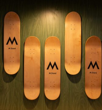 A row of wooden skis mounted to a wall