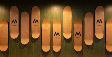 A row of wooden skis mounted to a wall