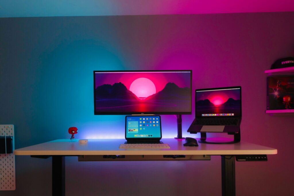 black flat screen computer monitor on brown wooden desk
