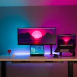 black flat screen computer monitor on brown wooden desk