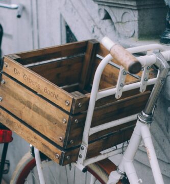 brown wooden crate on white bicycle