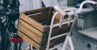 brown wooden crate on white bicycle