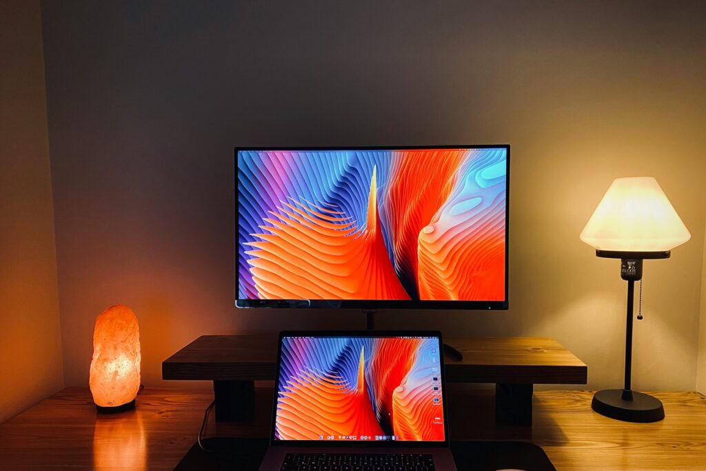 macbook pro on brown wooden table